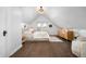 Bright bedroom with vaulted ceiling, hardwood floors, and ample light at 1127 Clayton St, Denver, CO 80206