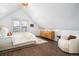 Bright bedroom with vaulted ceiling, hardwood floors, and ample light at 1127 Clayton St, Denver, CO 80206