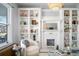 Bright living room with built-in shelves, fireplace and comfortable seating at 1127 Clayton St, Denver, CO 80206