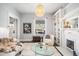 Spacious living room features built-in shelving and a cozy fireplace at 1127 Clayton St, Denver, CO 80206