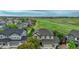 Lovely two-story home overlooking expansive community green space and many neighborhood homes nearby at 16747 E 97Th Pl, Commerce City, CO 80022
