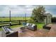 Backyard patio with outdoor seating, fire pit, and shed, perfect for outdoor entertaining at 16747 E 97Th Pl, Commerce City, CO 80022