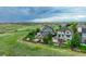 A lush green lawn, patio seating and fire pit compliment the exterior of this home at 16747 E 97Th Pl, Commerce City, CO 80022