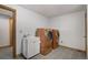 Laundry room with modern washer and dryer, plus a sink and storage at 16747 E 97Th Pl, Commerce City, CO 80022