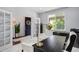 Bright and inviting home office with modern furnishings and a view to the outdoors, perfect for work or study at 16747 E 97Th Pl, Commerce City, CO 80022