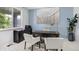 Well lit home office featuring a large desk, comfortable seating, and stylish decor, perfect for productivity at 16747 E 97Th Pl, Commerce City, CO 80022