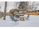 Snowy backyard with firepit and pergola at 3256 N Clay St, Denver, CO 80211