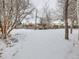 Snowy backyard with a pergola and seating area at 3256 N Clay St, Denver, CO 80211