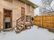 Small backyard with wooden steps and access to basement at 3256 N Clay St, Denver, CO 80211