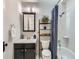 Clean bathroom with shower/tub combo and updated vanity at 3256 N Clay St, Denver, CO 80211