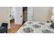 Bright bedroom with hardwood floors and access to a small dining area at 3256 N Clay St, Denver, CO 80211