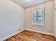 Simple bedroom with hardwood floors and window with shutters at 3256 N Clay St, Denver, CO 80211