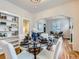 Bright dining room with hardwood floors and a glass dining table at 3256 N Clay St, Denver, CO 80211