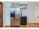 Kitchen with stainless steel refrigerator and ample storage at 3256 N Clay St, Denver, CO 80211