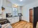 Kitchen with stainless steel appliances and hardwood floors at 3256 N Clay St, Denver, CO 80211