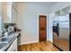 Kitchen with stainless steel appliances and hardwood floors at 3256 N Clay St, Denver, CO 80211