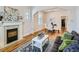 Living room with hardwood floors, fireplace, and dining area at 3256 N Clay St, Denver, CO 80211