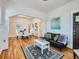 Open living and dining area with hardwood floors and a fireplace at 3256 N Clay St, Denver, CO 80211