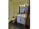 Chic half bathroom with modern vanity, updated fixtures, and stylish decor at 9983 Cottoncreek Dr, Highlands Ranch, CO 80130