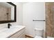 The bathroom features modern fixtures, a sleek vanity, and a neutral color palette at 9983 Cottoncreek Dr, Highlands Ranch, CO 80130