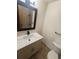 Stylish bathroom featuring modern vanity with stone countertop and a tiled shower at 9983 Cottoncreek Dr, Highlands Ranch, CO 80130