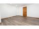 This bonus bedroom has an expansive room with neutral walls and luxury vinyl plank flooring at 9983 Cottoncreek Dr, Highlands Ranch, CO 80130