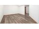 This bonus bedroom has an expansive room with neutral walls and luxury vinyl plank flooring at 9983 Cottoncreek Dr, Highlands Ranch, CO 80130