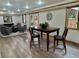 Basement dining area with wood table set and elegant decor throughout at 9983 Cottoncreek Dr, Highlands Ranch, CO 80130