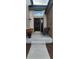 The main entrance has a wreath on the door, two chairs on the front porch and a planter with flowers at 9983 Cottoncreek Dr, Highlands Ranch, CO 80130