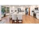 Spacious kitchen features white cabinets, stainless steel appliances, hardwood floors, and a bright, open layout at 9983 Cottoncreek Dr, Highlands Ranch, CO 80130