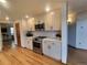 Updated kitchen showcasing stainless steel appliances, modern finishes, and ample cabinet space at 9983 Cottoncreek Dr, Highlands Ranch, CO 80130