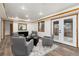 Bright living room showcases recessed lighting, wood trim, and elegant decor at 9983 Cottoncreek Dr, Highlands Ranch, CO 80130