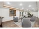 Spacious living room with recessed lighting, wood trim, and a stylish sitting area at 9983 Cottoncreek Dr, Highlands Ranch, CO 80130