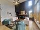 Modern living room featuring high ceilings, large windows, hardwood floors, and lots of natural light at 9983 Cottoncreek Dr, Highlands Ranch, CO 80130