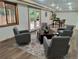 Relaxing living room with plush seating and a stylish rug on wood floors at 9983 Cottoncreek Dr, Highlands Ranch, CO 80130