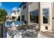 Outdoor patio features a metal table and seating, perfect for enjoying the view of the surrounding neighborhood at 9983 Cottoncreek Dr, Highlands Ranch, CO 80130