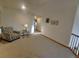 Cozy upstairs seating area with carpet floors and a reading nook at 9983 Cottoncreek Dr, Highlands Ranch, CO 80130