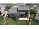 Aerial view of the home with a deck, patio, and large backyard with mature trees at 6062 S Emporia Cir, Englewood, CO 80111