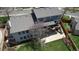 Birds eye view of the property, highlighting the deck, patio, and large grassy yard at 6062 S Emporia Cir, Englewood, CO 80111