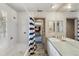Bathroom featuring a tub and shower, double sink vanity, and neutral design at 6062 S Emporia Cir, Englewood, CO 80111