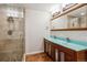 Bathroom with dual vanity, and tiled shower at 6062 S Emporia Cir, Englewood, CO 80111