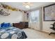 Bedroom with a charming decor and ample natural light at 6062 S Emporia Cir, Englewood, CO 80111