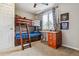 Bedroom featuring a bunk bed and a study area at 6062 S Emporia Cir, Englewood, CO 80111