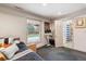 Bedroom with a view to the backyard, natural light, and an en suite bathroom at 6062 S Emporia Cir, Englewood, CO 80111