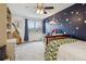 Bright bedroom with unique wall decor and a spacious layout at 6062 S Emporia Cir, Englewood, CO 80111