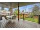 Deck with table and chairs for outdoor dining and views of the well-maintained backyard at 6062 S Emporia Cir, Englewood, CO 80111