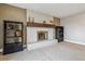 Living room featuring a white brick fireplace and nice carpet at 6062 S Emporia Cir, Englewood, CO 80111