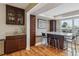 Kitchen featuring a granite countertop island and modern appliances at 6062 S Emporia Cir, Englewood, CO 80111