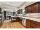Updated kitchen with stainless steel appliances, ample counter space, and wood floors at 6062 S Emporia Cir, Englewood, CO 80111