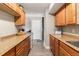 Efficient kitchen featuring granite countertops and oak cabinets, offering plenty of storage at 709 Arrow Ct, Lafayette, CO 80026